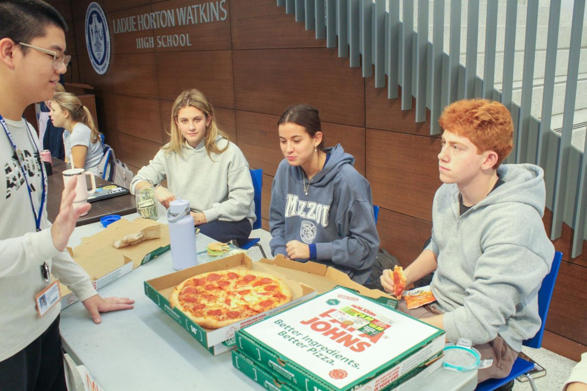 Ladue students sell pizza during lunch to raise money for Dance Marathon Nov. 21. "We have a lot of fun in Dance Marathon," Gabe Fields (12) said, "We do a lot of stuff like this to raise money and most of the time we get a lot."