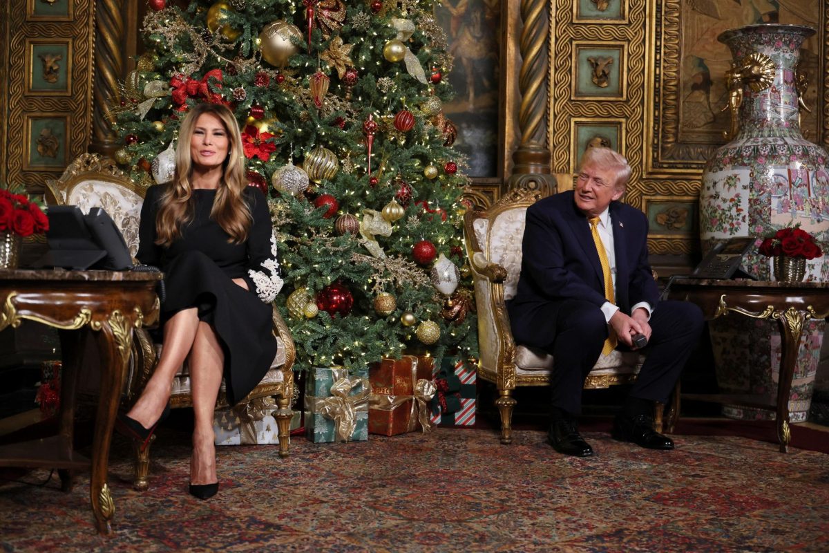 U.S. President Donald Trump and first lady Melania Trump participate in NORAD Santa tracker phone calls, on Christmas Eve, from the Mar-a-lago club in Palm Beach, Florida, U.S., December 24, 2025. REUTERS/Jessica Koscielniak