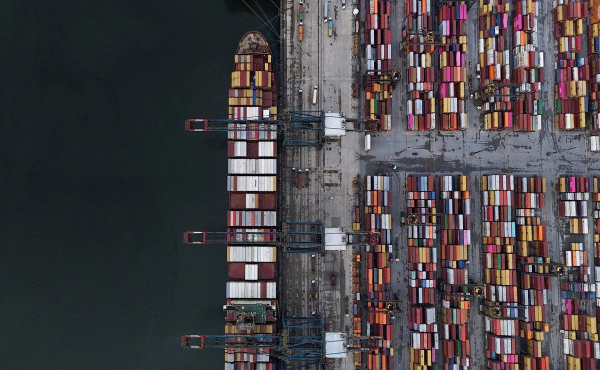 A drone view shows a ship and containers at the Port of Santos, in Santos, Brazil April 3, 2025. REUTERS/Amanda Perobelli