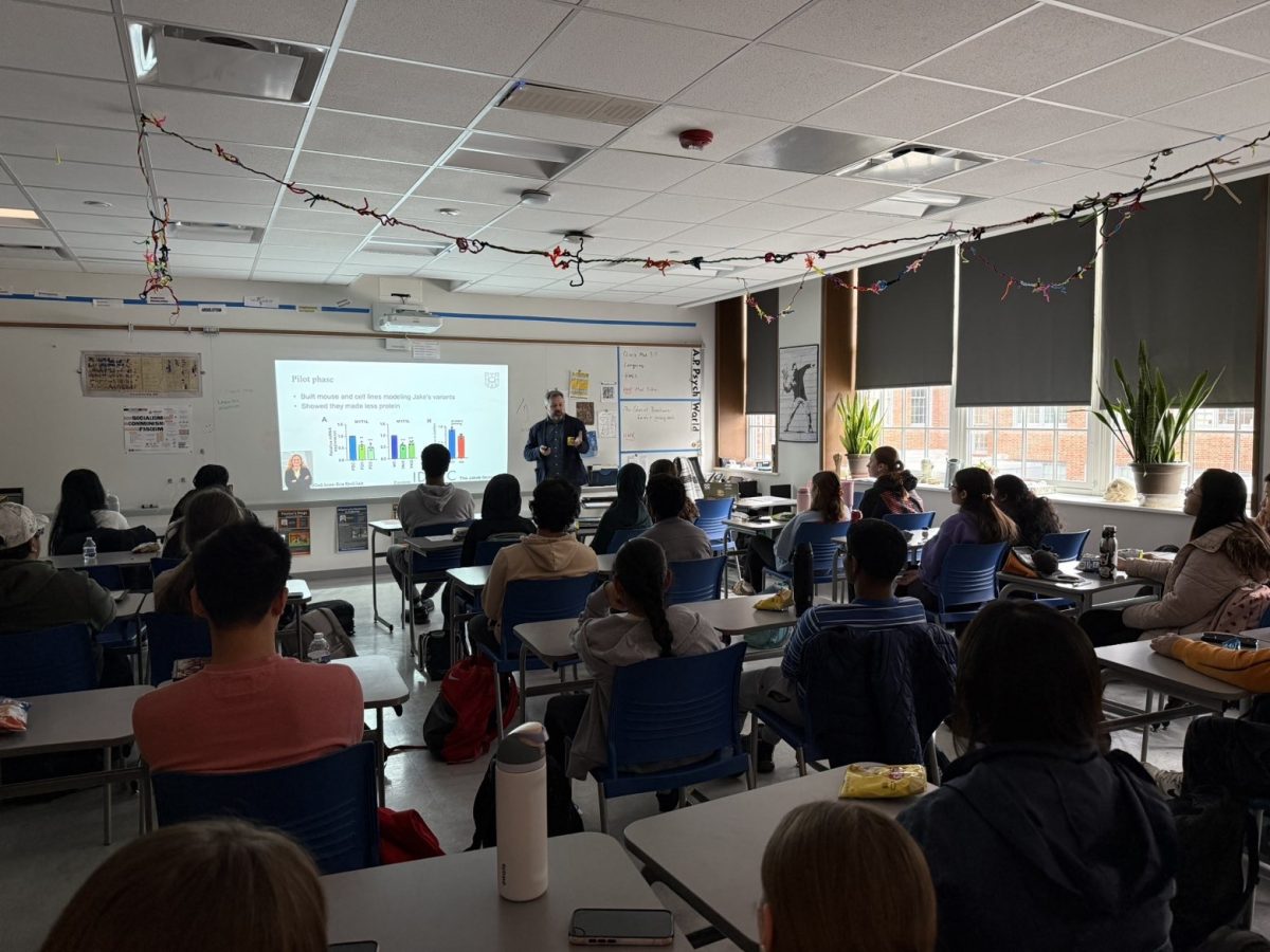 Club Neuro members watch as Dr. Joseph Doughtery presents his research on psychiatry and genetic disorders. The club was established in 2017 as an outlet for students to explore neuroscience.“I think a future goal for Club Neuro is for members to be able to help others in the community and gain education in neuroscience,”Adireddi said. “One way we do this is through members designing educational posters, which we can then send out to hospitals and local clinics to improve patients’ awareness of uncommon neurological disorders.” 