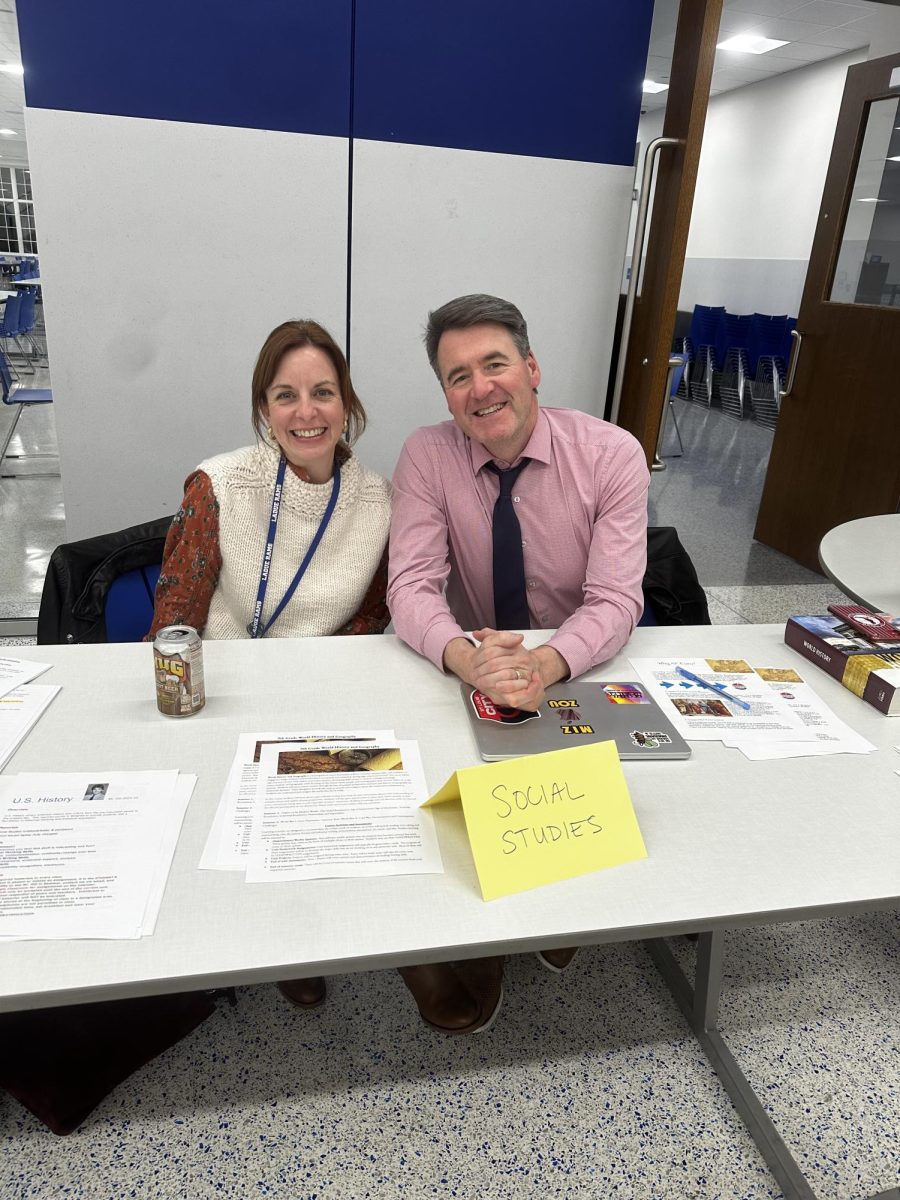 Social studies teacher Ashley Lock and department head Mike Hill end Curriculum Night surrounded by handouts, flyers and textbooks. The materials offered helpful tips and elements specific to classes, such as the project-based component to the Current Events class that the department plans to offer next year. “[The class] will be in tandem to the seniors’ government class,” Hill said. “As you learn about the government, you go practice. That is going to be important.”