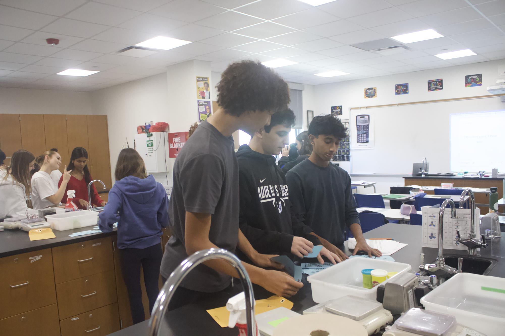 Chemistry students work on VSEPR lab Jan. 21
