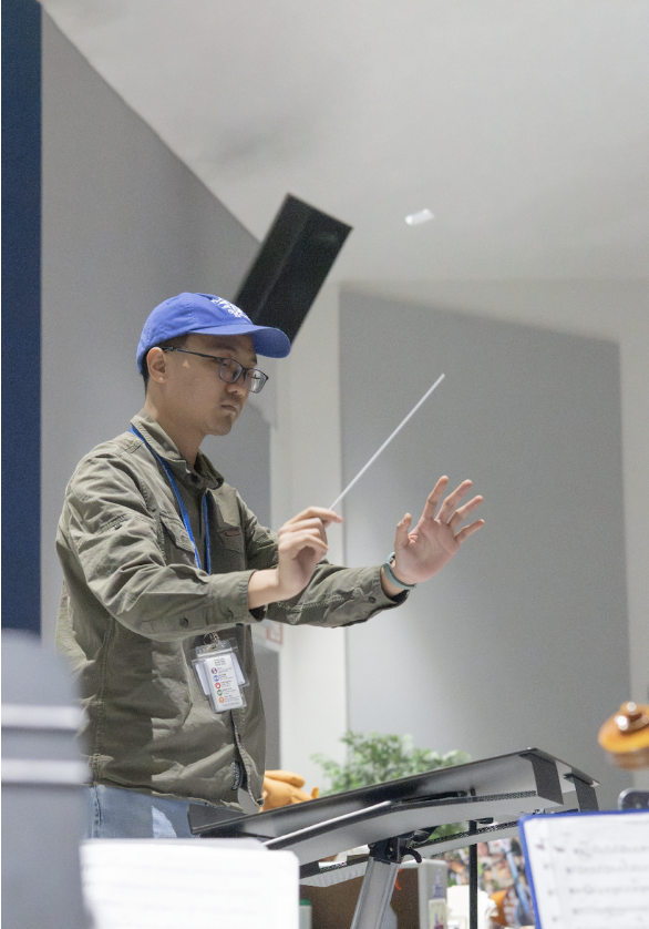 Xinyi Lu waves his baton as he conducts concert orchestra class. For two years, he’s worked with Sarah Heuermann to direct Ladue’s orchestras. “[My favorite piece Ladue’s played] is Dies Irae, from last year,” Lu said. “The emotion of that piece is very strong, and I could clearly feel what Mozart [wanted] to express.”
