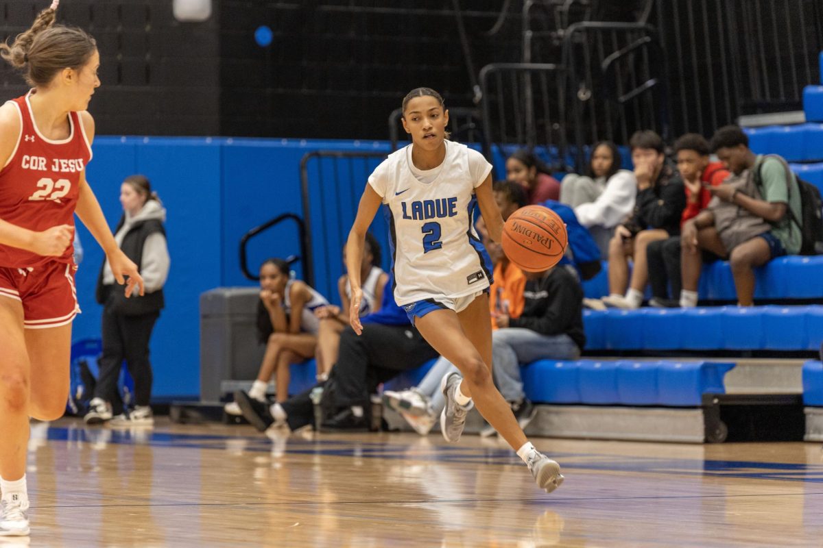 Marley Robinson (10) dribbles down the court Nov. 25 as Cor Jesu Academy defender drops back to defend. Robinson currently averages nine points a game. "The program seems to be better this year," Robinson said. "A good thing is our team dynamic and how we get along."