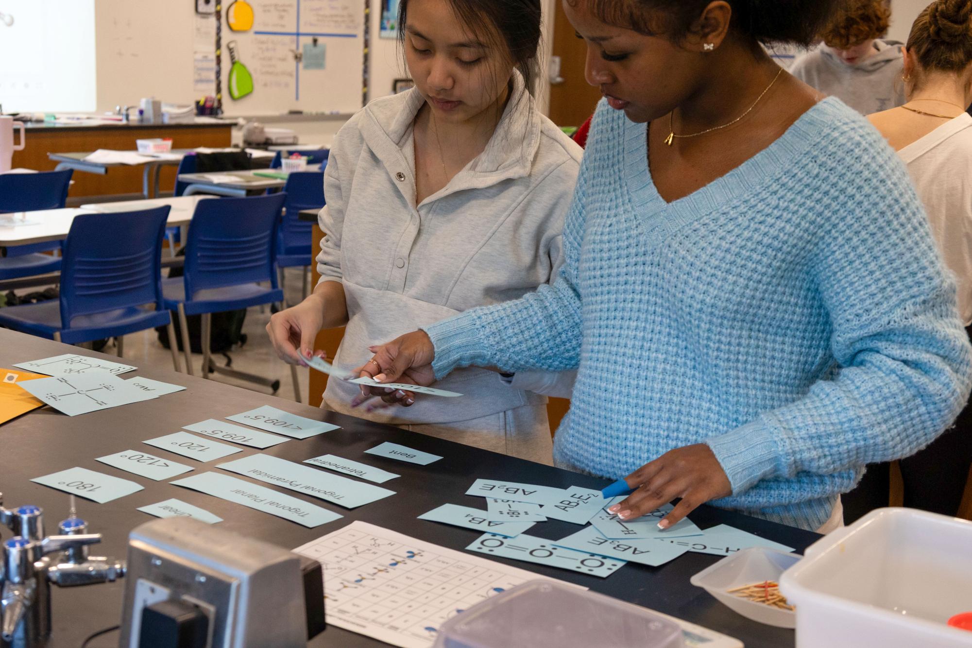 Students perform a chemistry lab building molecular structures Jan. 21.