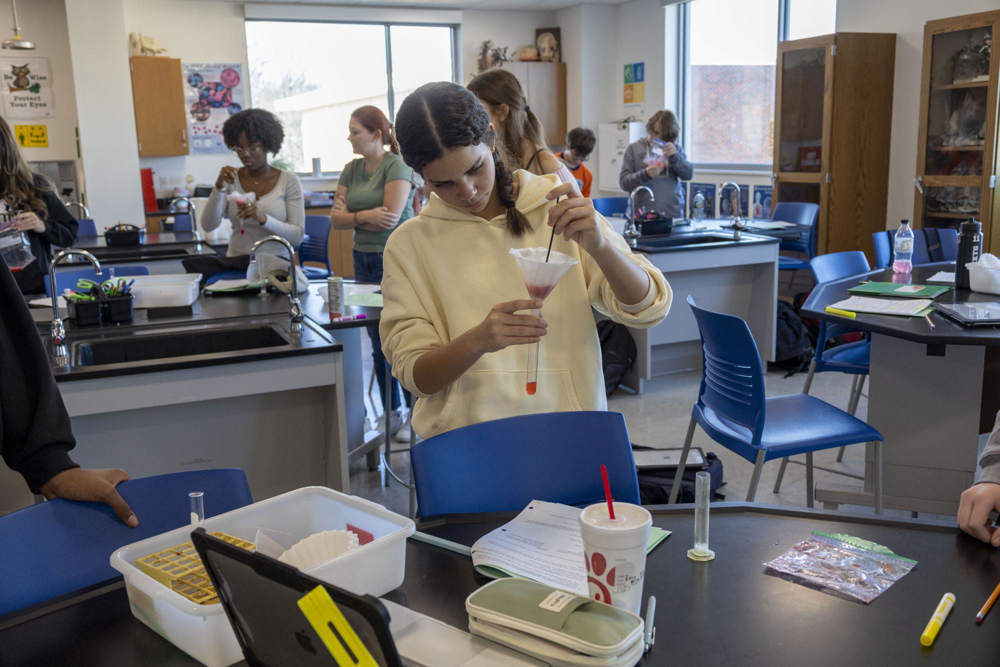 Freshmen biology students separate DNA from strawberries