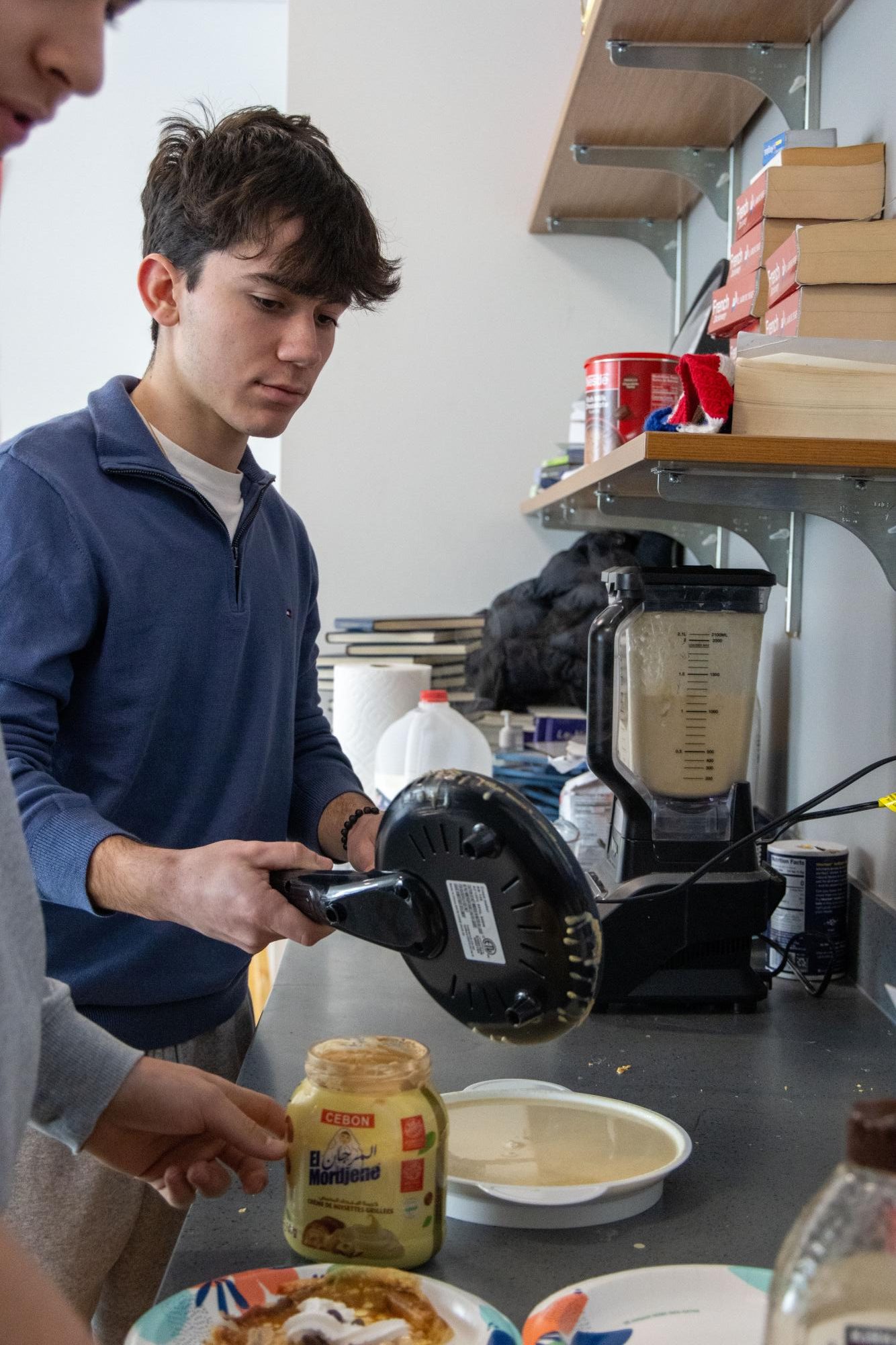AP French students celebrate La Chandeleur by making crêpes in class