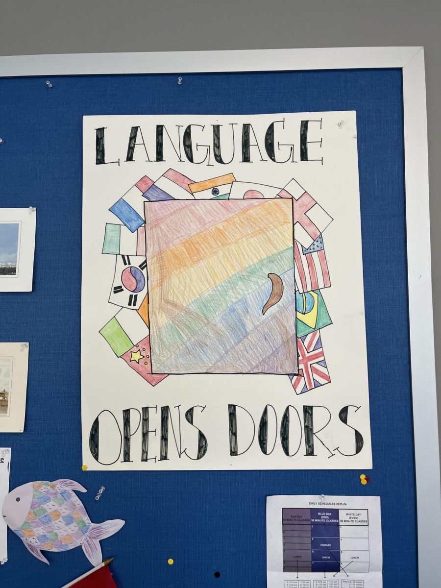 A past winner of the International Week Poster Contest is displayed in room 2328. The theme for the poster was 'Language Opens Doors.' "Our theme this year is 'Languages and Cultures Color the World,' so I am anticipating some very creative and colorful posters this year," French teacher Elise Dale said.