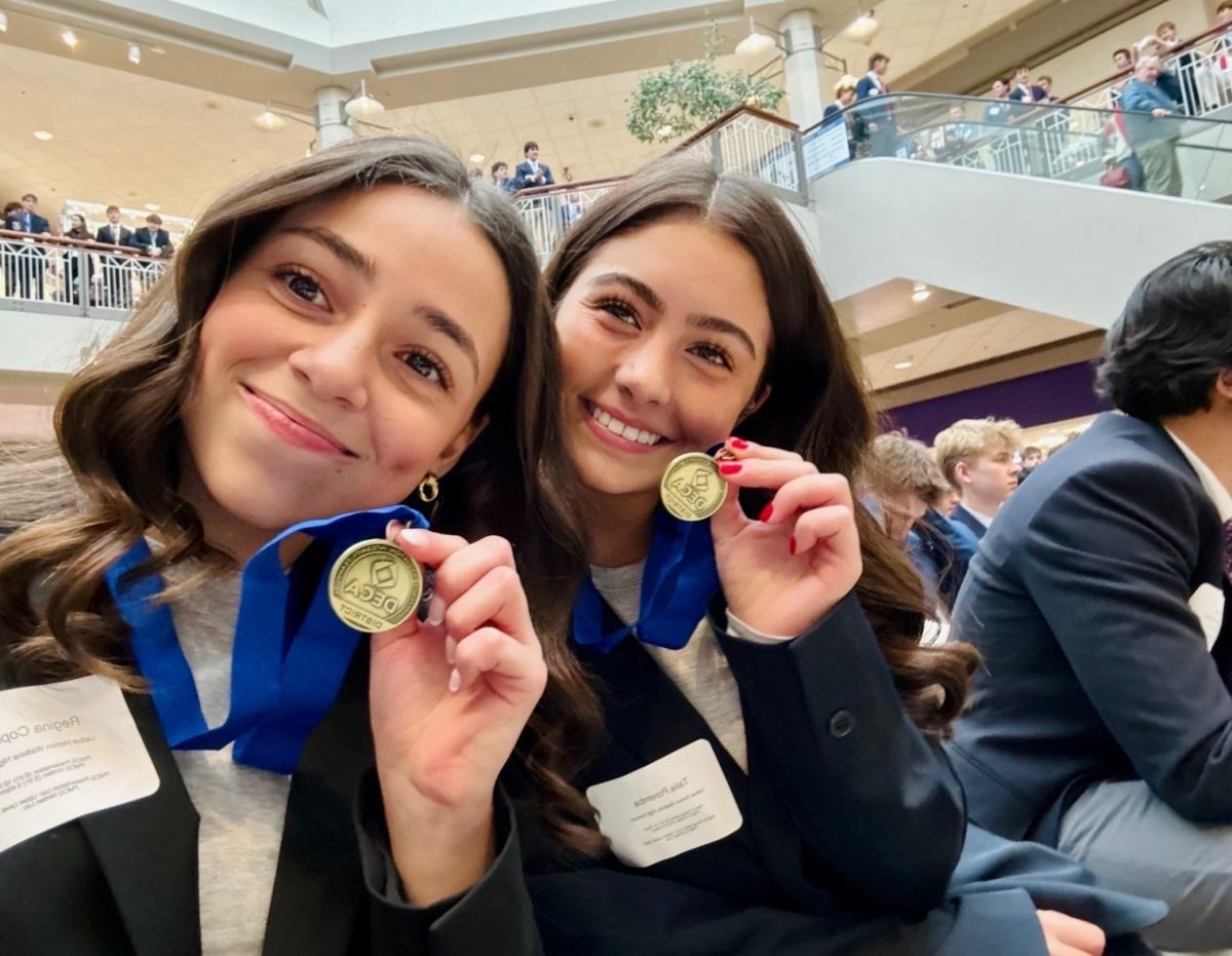 Talia Poremba (10) and Regina Copeland (10) compete at the district competition in the Project Management and Community Giving event. They began preparing for this competition in Sept.  “The most enjoyable part [of the project] was to see it all coming together, and those donations helping families,” Poremba said.