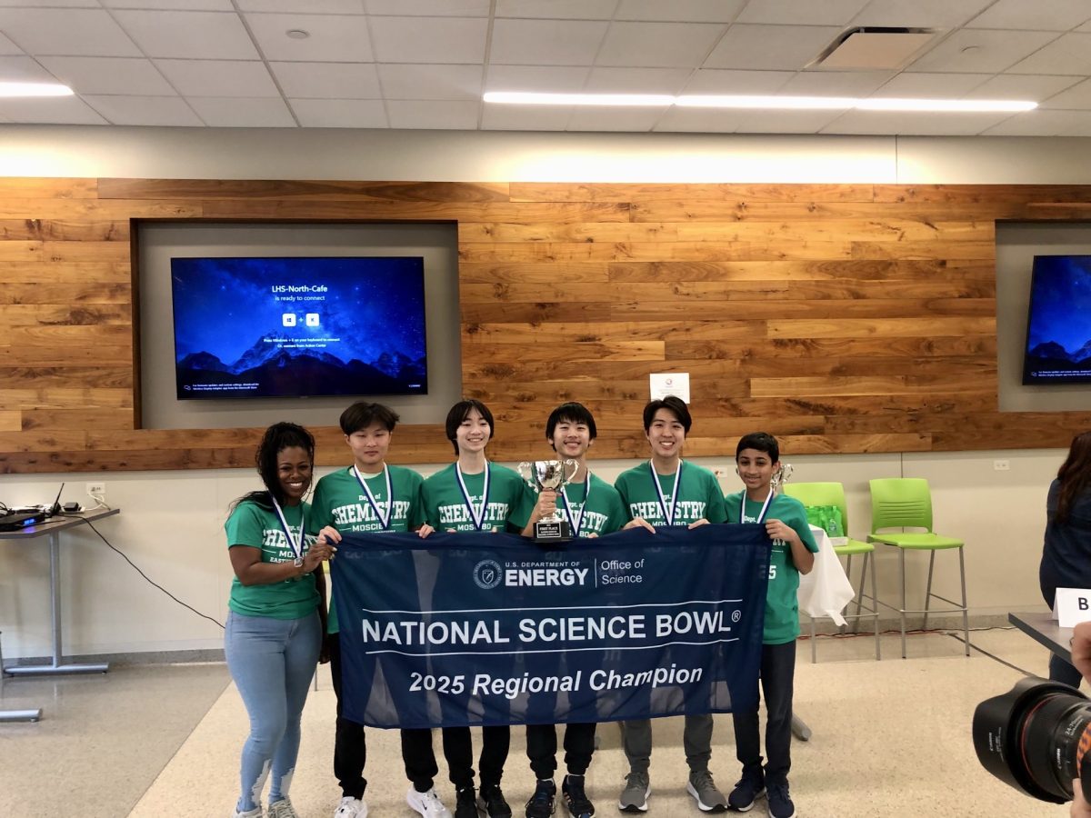 Ayden Huang (10), Alex Wang (12), Aaron Lin (12), Anthony Zhao (12) and Rishi Suri (10) hold the Regional Champion banner. The winning team from each of the 46 middle and 64 high school regionals competed in the National Finals, held in Washington, D.C., from April 24-28, 2025.  “We hope to bring more awards to this amazing high school, which we’re so proud of [representing],” Zhao said. 

Photo courtesy of Anthony Zhao.