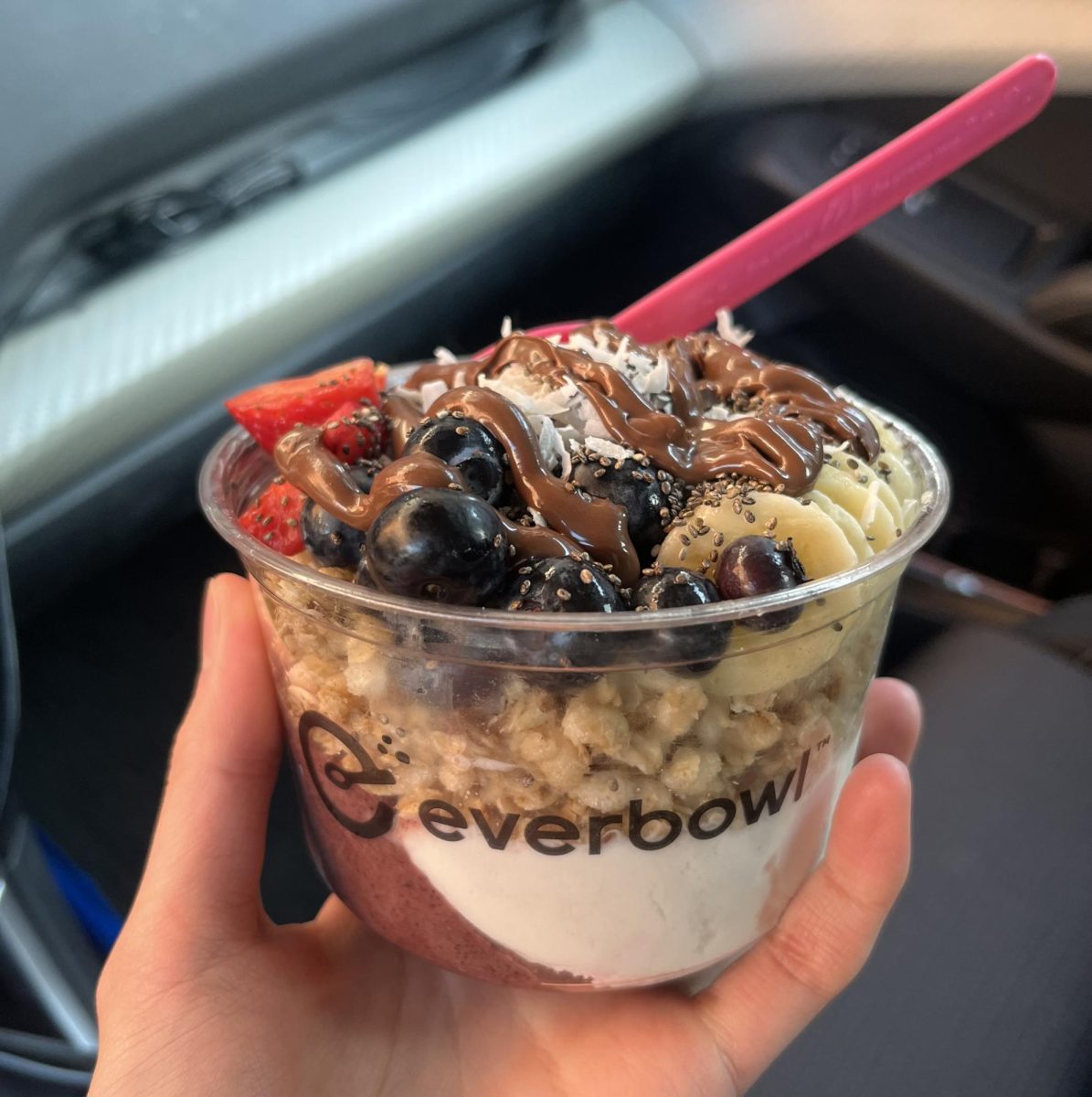 Whatever Bowl with acai and vanilla base, granola, strawberries, blueberries, banana, coconut, chia seeds and nutella drizzle