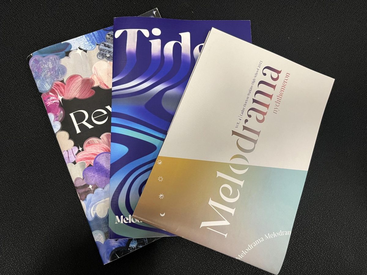 Past editions of Melodrama lay on a table. The publication stopped taking submissions March 13. “I enjoy how Melodrama shows the different ways students express themselves through different art forms,” Co-Editor-in-Chief Maya Mathew (12) said. 
