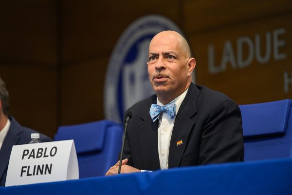 Pablo Flinn, an incumbent candidate, speaks at the Meet the Candidates Community Forum March 30. The four candidates were invited to speak to community members and answer presubmitted questions in a forum organized by the League of Women Voters. "Every day, I show up to be of service," Flinn said. "I do it outside and inside of this role. I don’t get anything from it, but the knowledge that I’m being of service. That’s why I was put here. I will listen, I will honor your voice. On the current board, we’re willing to lean on each other, listen to each other, have tough conversations with each other. I will continue to be part of that.”
